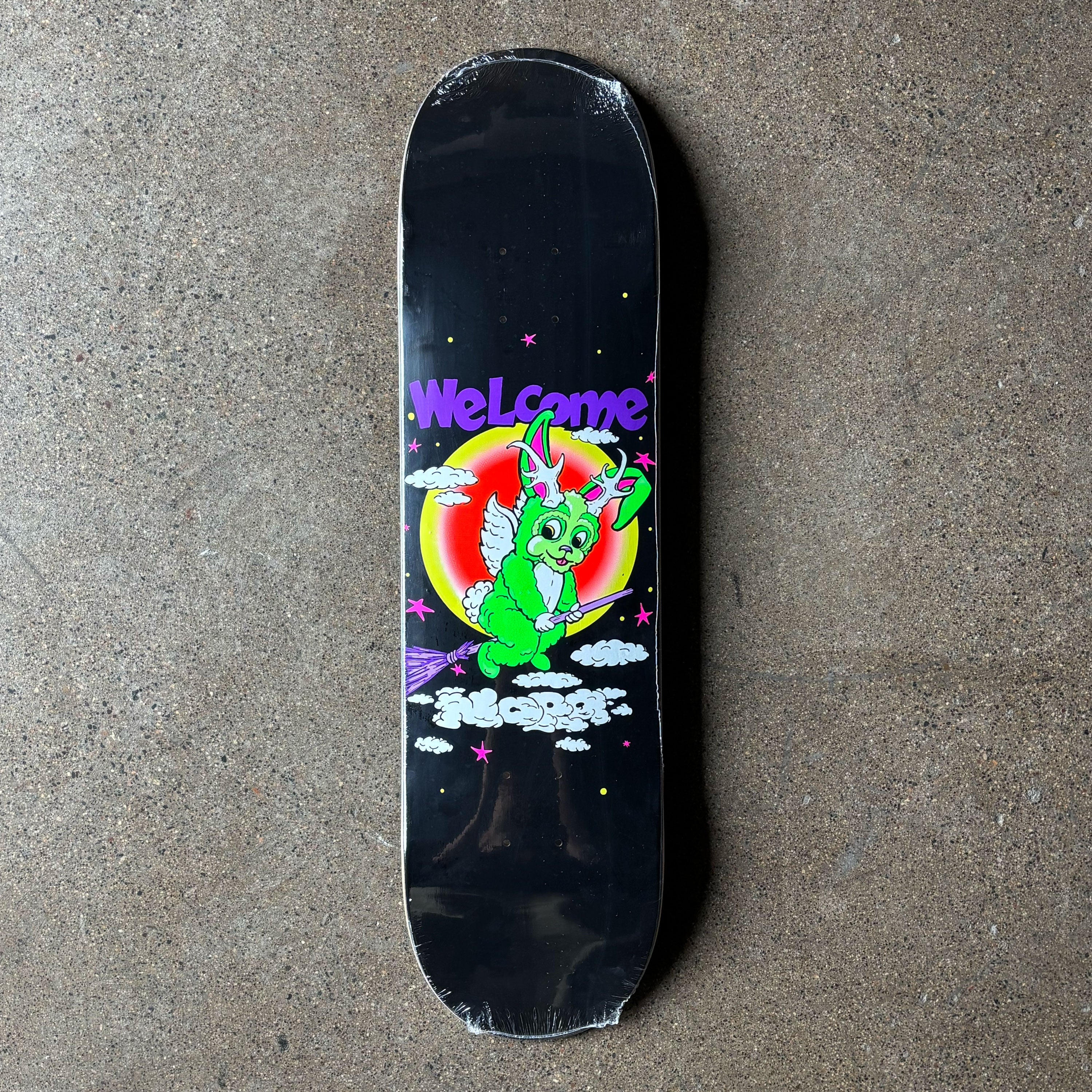 Full image of deck with cartoon art in center